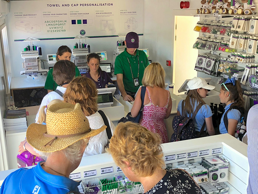 Personalisation booth at Wimbledon full of people looking to purchase